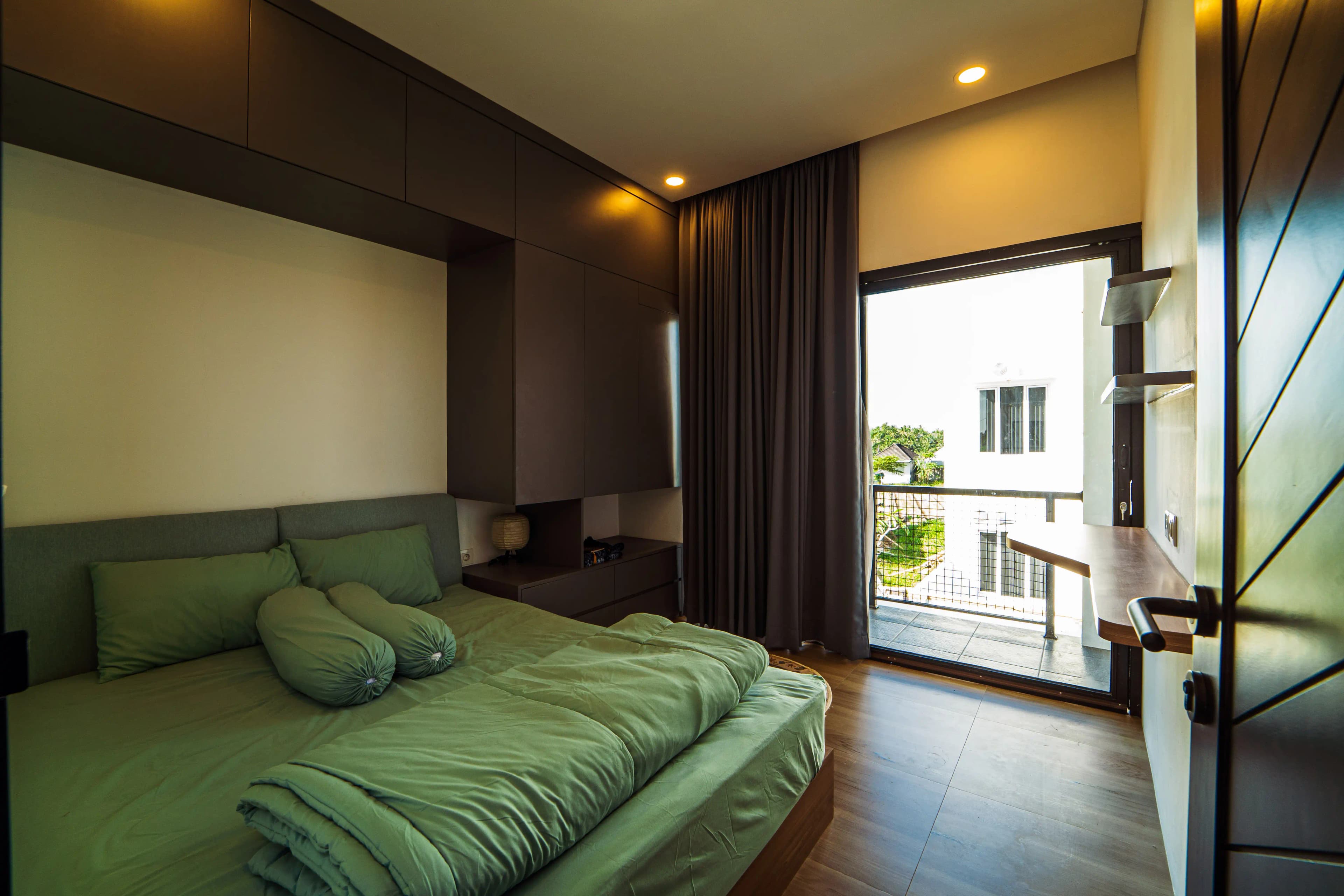 Interior design team collaborating in a bright minimalist Balinese studio.